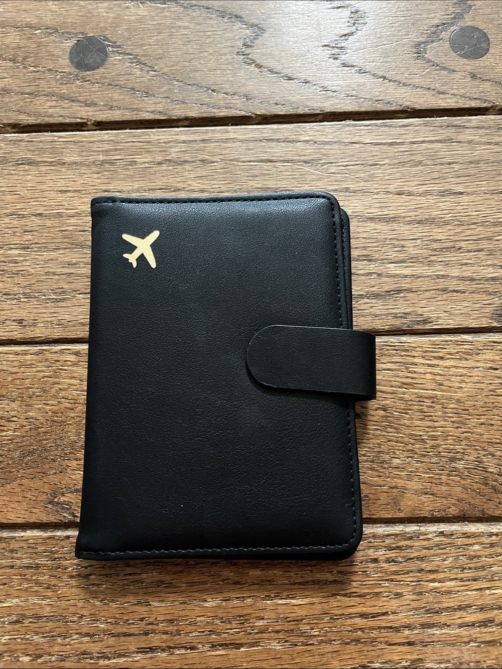 Black Travel Passport Holder with Gold Airplane Accent